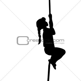 Silhouette girl climbs up the rope