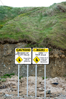 dual beware of cliff falls signs