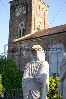 faceless monk statues outside church
