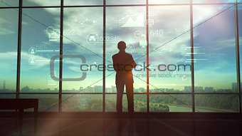 Silhouette of man and corporate infographics