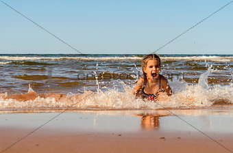 Little girl playing on the Brackley beach