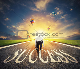 Man ready to run on a success way. Concept of successful businessman and company startup