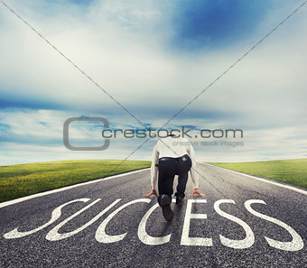 Man ready to run on a success way. Concept of successful businessman and company startup