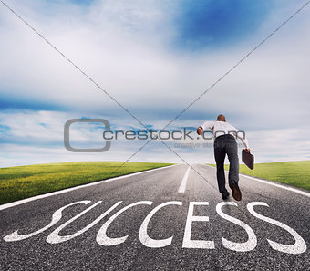 Man runs on a success way. Concept of successful businessman and company startup