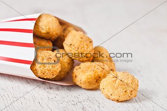 Paper container with fried crispy chicken popcorn