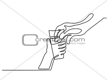 Hand giving water in glass to child