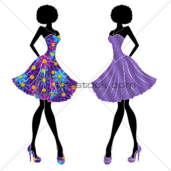 Slender stylish girls in short dresses