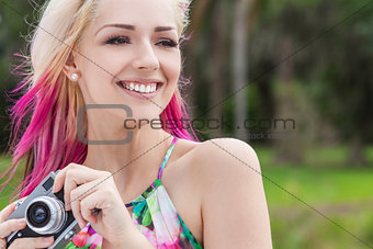 Woman With Blond and Magenta Pink Hair Using Camera