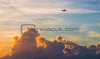 Passenger Jet Aeroplane high above the clouds 