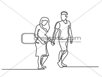 Happy pregnant woman walking with her husband