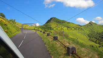Driving on the road in Puy Mary, volcanic french mountains