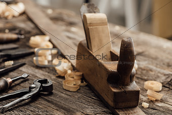 Wood planer on the carpenter's workbench