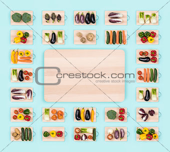 Fresh vegetables and wooden chopping board