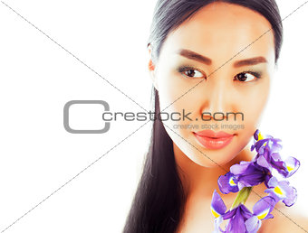 young pretty asian woman with flower orchid close up isolated sp