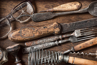 Old vintage kitchen items on a wooden background
