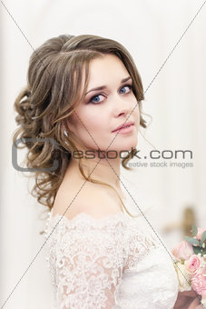 portrait of the bride on a light background