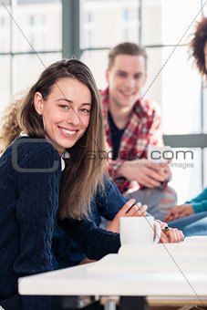 Millennial students watching together an online funny video