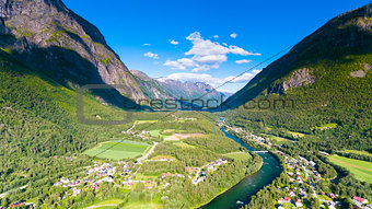 Norway in summer. Country town, river and mountains natural landscape aerial drone photography
