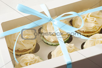 sweet present. gift box with cupcakes