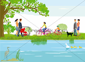 Families relax by the lake