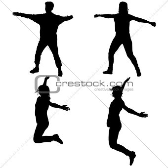 Silhouette of young people jumping with hands up, motion