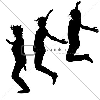 Silhouette of three young girls jumping with hands up, motion