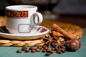 horizontal picture of a beautiful cup of coffee, anise and cinna