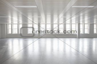 Vacant open plan office space with windows
