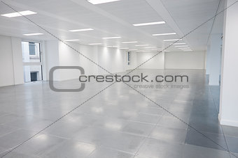 Vacant open plan office space with lights on