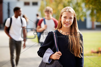 Portrait Of Female Teenage Student On College Campus