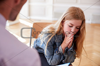 School Counselor Talking To Depressed Female Pupil