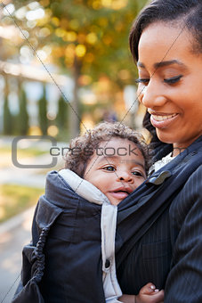Businesswoman With Baby Son Leaving House For Work