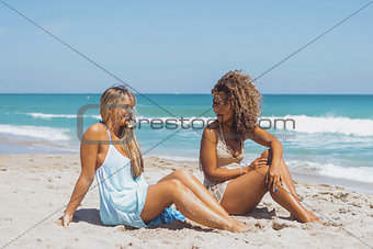 Content women enjoying tropical beach