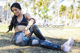 Young fit woman training on meadow