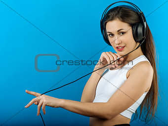 Attractive woman enjoying music with headphones