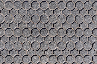Hexagonal patterned manhole cover background