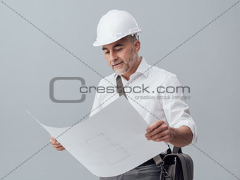 Architect checking a blueprint