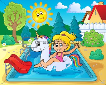 Girl floating on inflatable unicorn 3