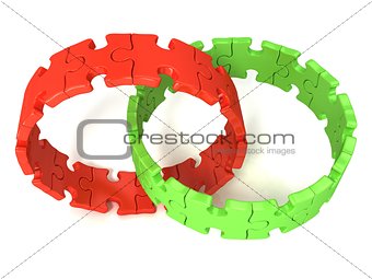 Two red and green puzzle rings, isolated