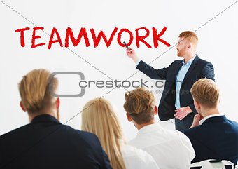 Businessman in office explain something about teamwork at a training meeting