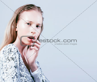 young pretty stylish blond hipster girl posing emotional isolate