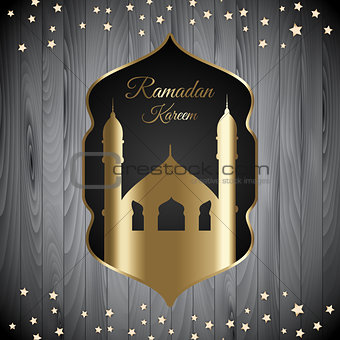 Ramadan Kareem background with mosque silhouette on wood texture