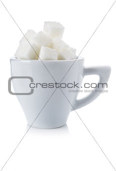 Cubes of white sugar in a white cup