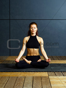 Redhead woman doing yoga