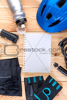 set of objects for cycling and a sheet of paper for inscription 