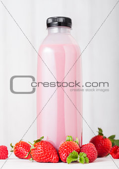 Plastic bottle with fresh summer berries smoothie