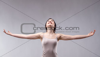Happy attractive young woman rejoicing