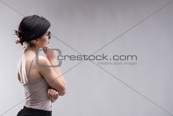Young brunette woman looking at copy space