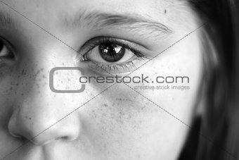 Closeup of eyes, freckles, and nose on a little girl