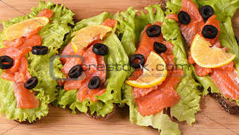 Sandwiches with red fish close up